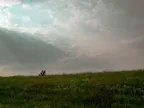 [PHOTO] Two people bicycling on a dike thumbnail