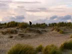 [PHOTO] Man walking in the dunes thumbnail